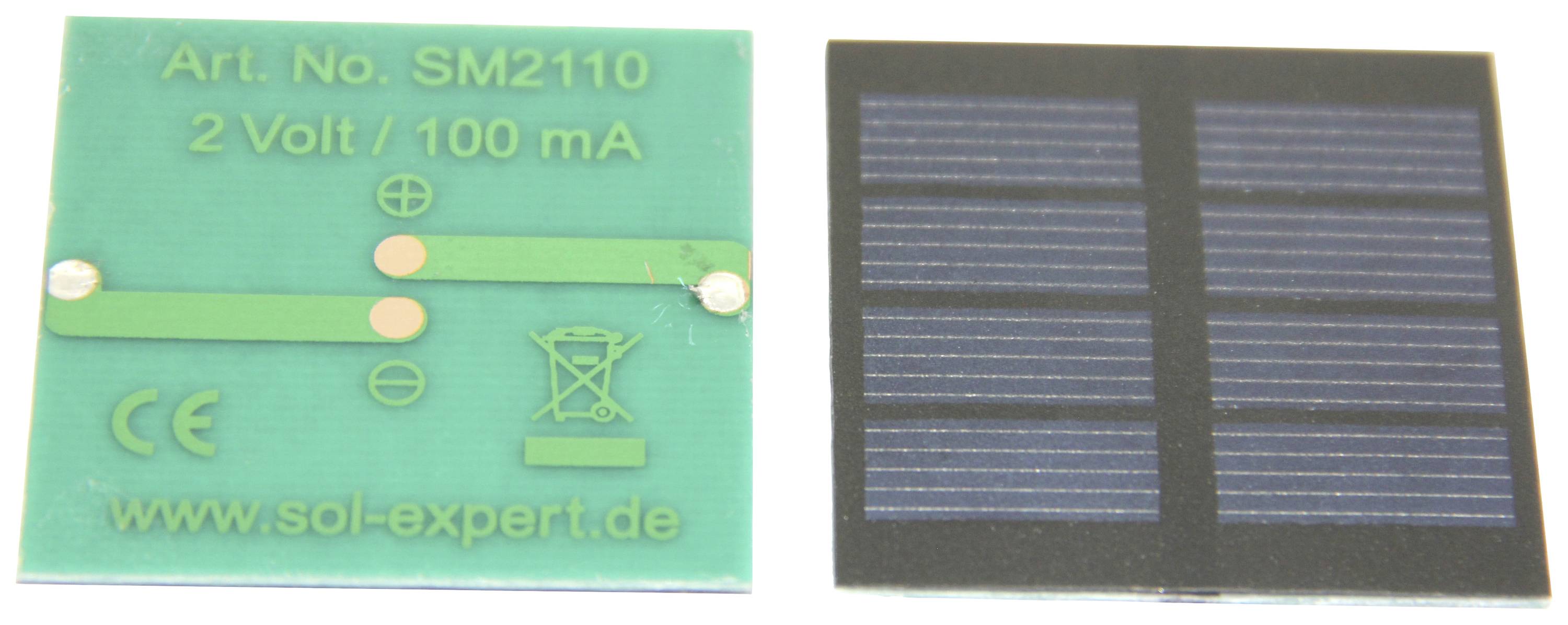 Two small solar modules, one with technical specifications ('2 volts / 100 mA') and manufacturer information ('sol-expert.de'), the other completely black.