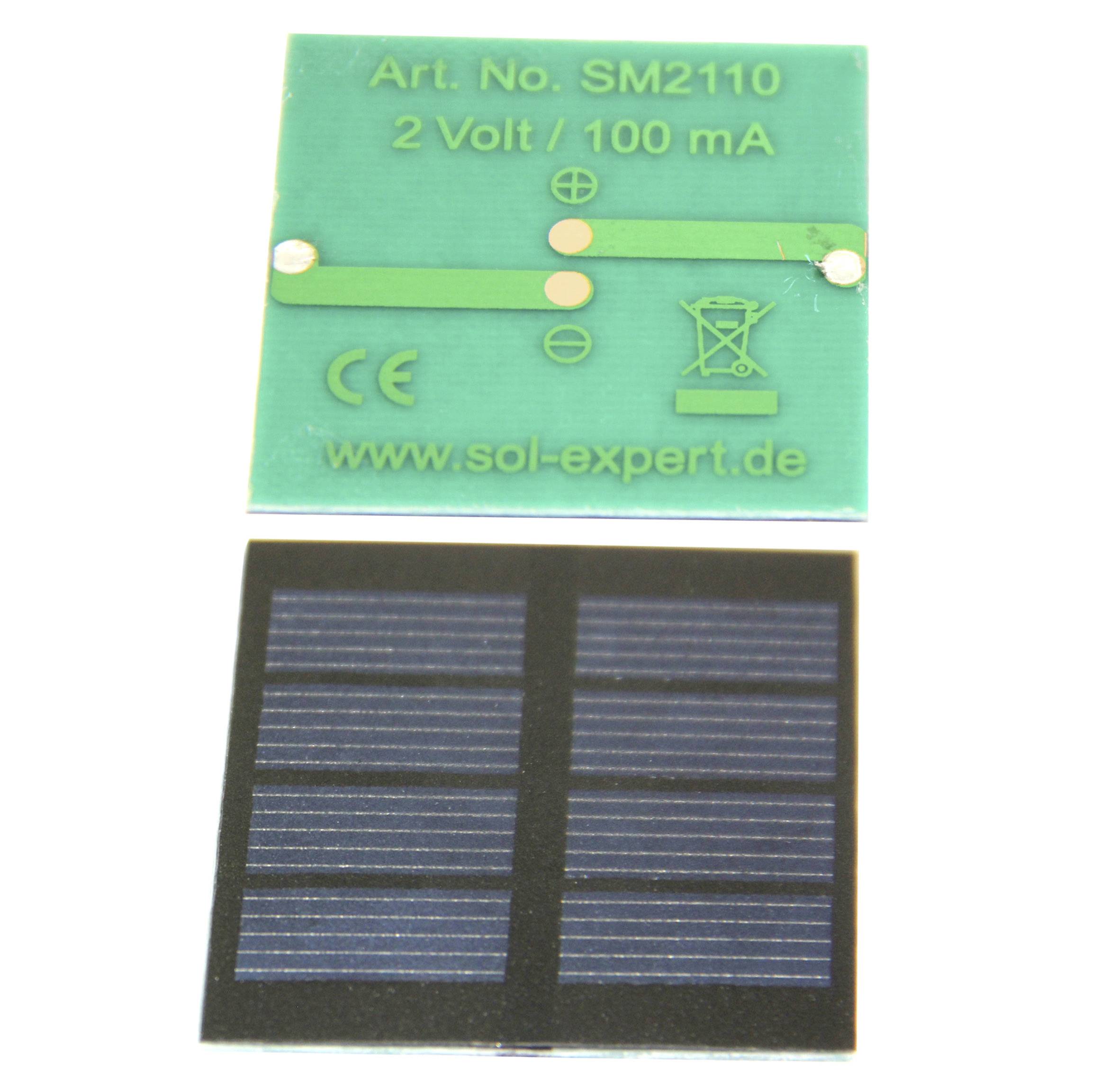 A small green solar cell with the inscription 'Art. No. SM2110 2 Volt / 100 mA' and a sun symbol display. Beneath it, a black solar surface.