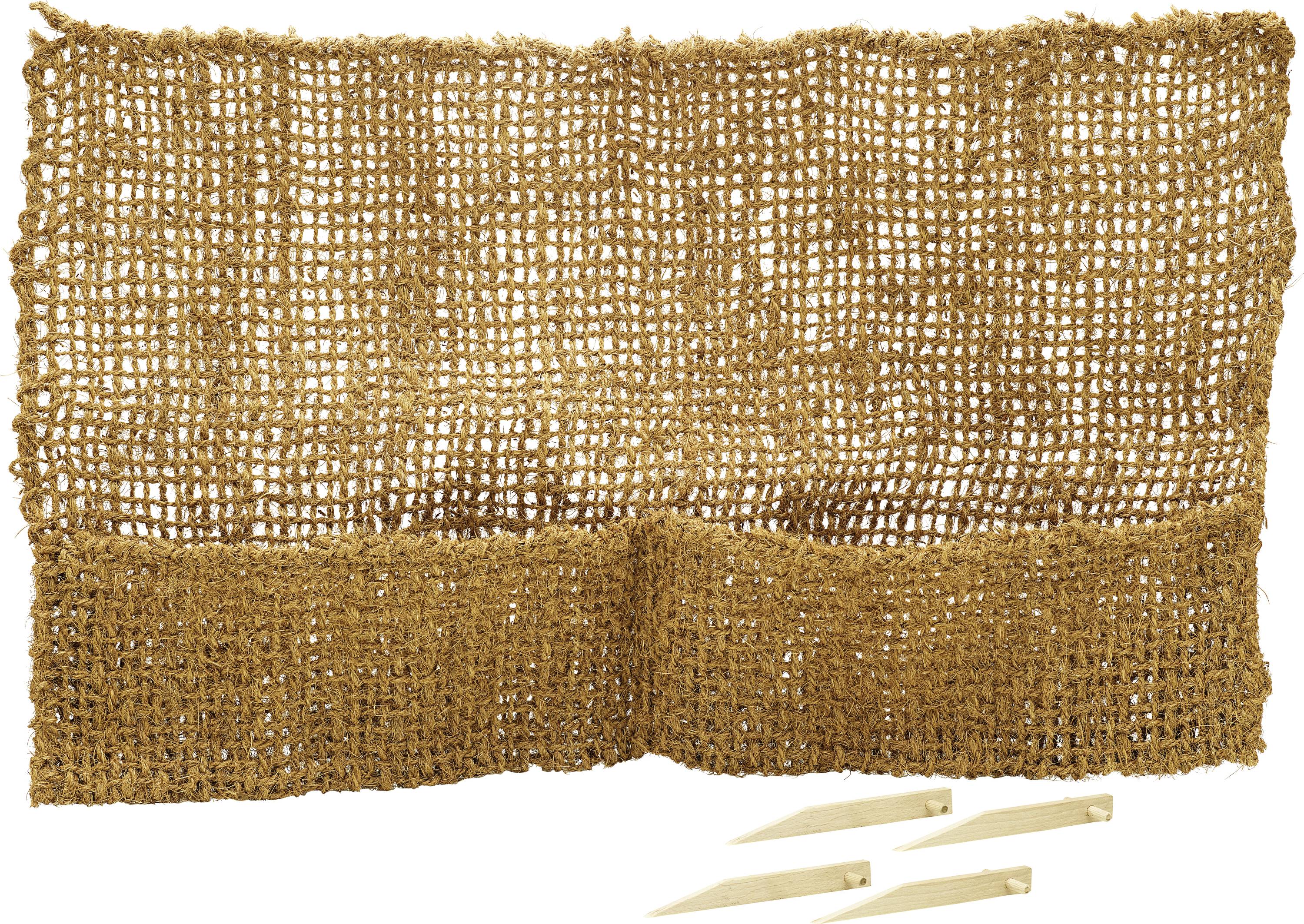 Brown burlap garden weed barrier with three wooden stakes below, used for ground cover to prevent weeds and promote plant growth.
