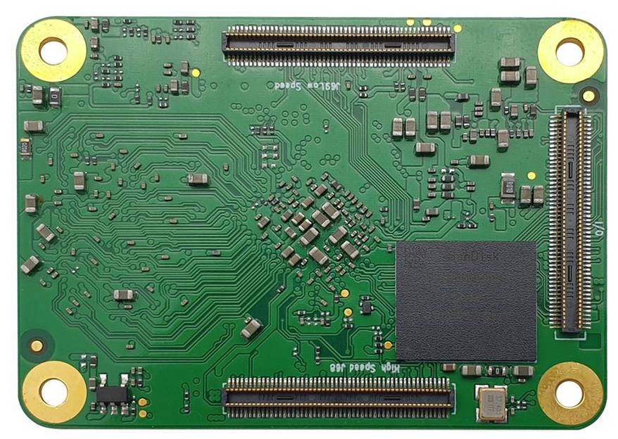 A green printed circuit board with various electrical components, including chips and connectors, mounted on a rectangular board.