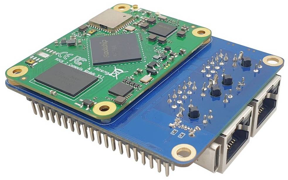Green and blue circuit board with multiple chips, pins, and three Ethernet ports. Electronic module for computer applications.
