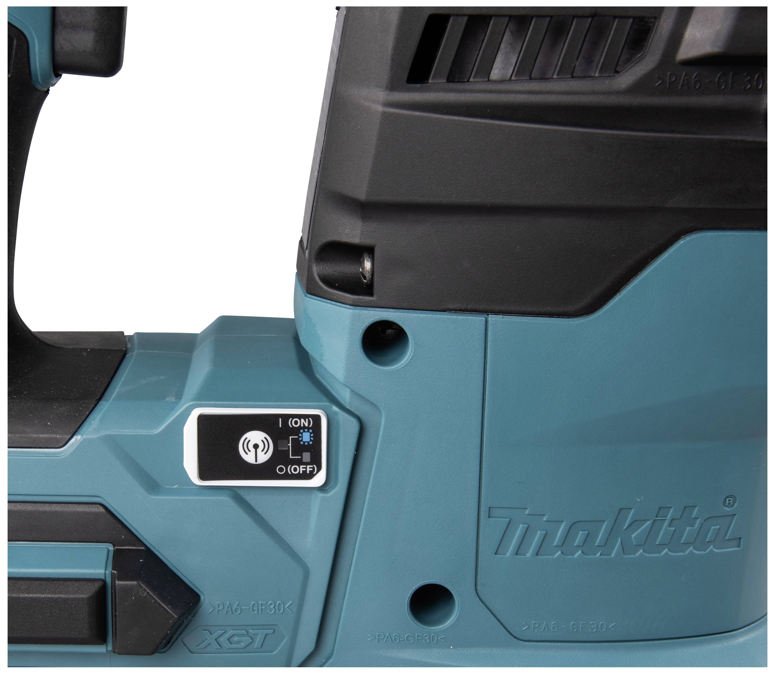 Close-up of electric power tool, blue casing with power switch, branded 'Makita'.