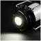 A bright lamp on a black background, emitting brilliant light.