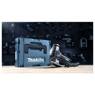 A Makita jigsaw and carrying case on a workbench, with a blurred background of tools, suggesting a workshop setting.