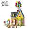 A colourful toy house with numerous balloons overhead, two figurines, a dog and accessories, suitable for children aged 9 and above, 598 pieces.