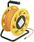 A yellow extension lead on a cable reel with a black handle and sturdy frame. The cable is orange.