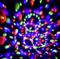 Colourful light patterns in red, green and blue swirl against a black background, as if they are in motion.