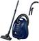 Blue vacuum cleaner with suction hose and accessories. Designed for efficient cleaning. Suitable for various floor types.