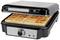 Waffle iron holding two rectangular, golden-brown baked waffles. Silver control panel with rotary dial and indicator lights.