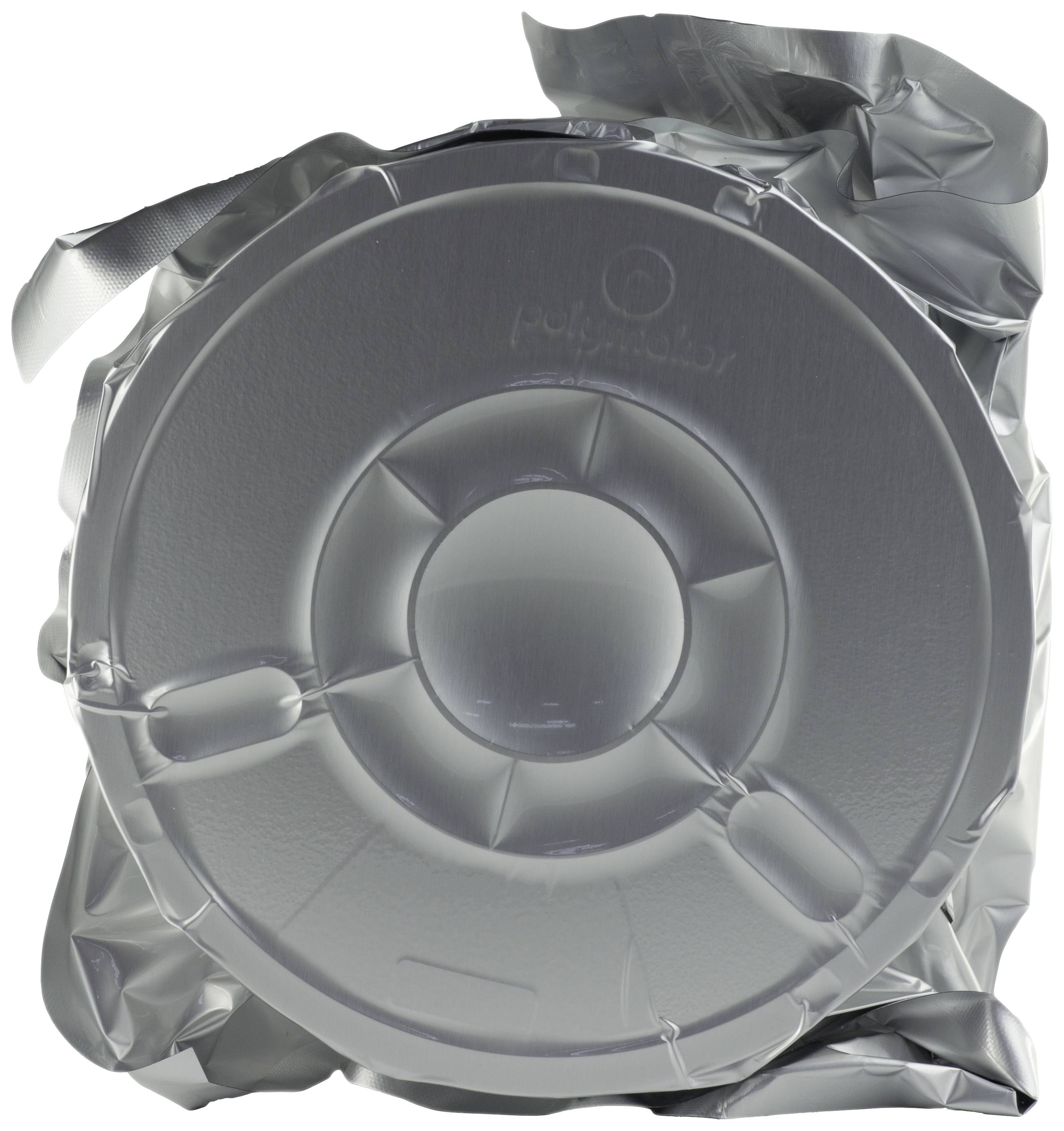 A round coffee package, vacuum-sealed in silver-coloured metal, with visible seams and texture.