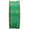 A reel of green plastic filament for 3D printers, standing and visible from the side, against a white background.