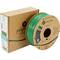 A green spool of Polymaker filament, suitable for 3D printing, sits beside a brown packaging with brand logo and product details.