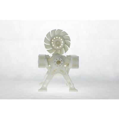 A white mechanical model with gear and propeller structure stands on transparent legs, against a light background.