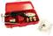 Red suitcase with welding equipment and accessories, including heating elements and cables, with an instruction manual beside it.