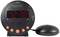 Black digital alarm clock with large LED display, showing '12:38'. To the left is a round, ribbed vibration cushion.