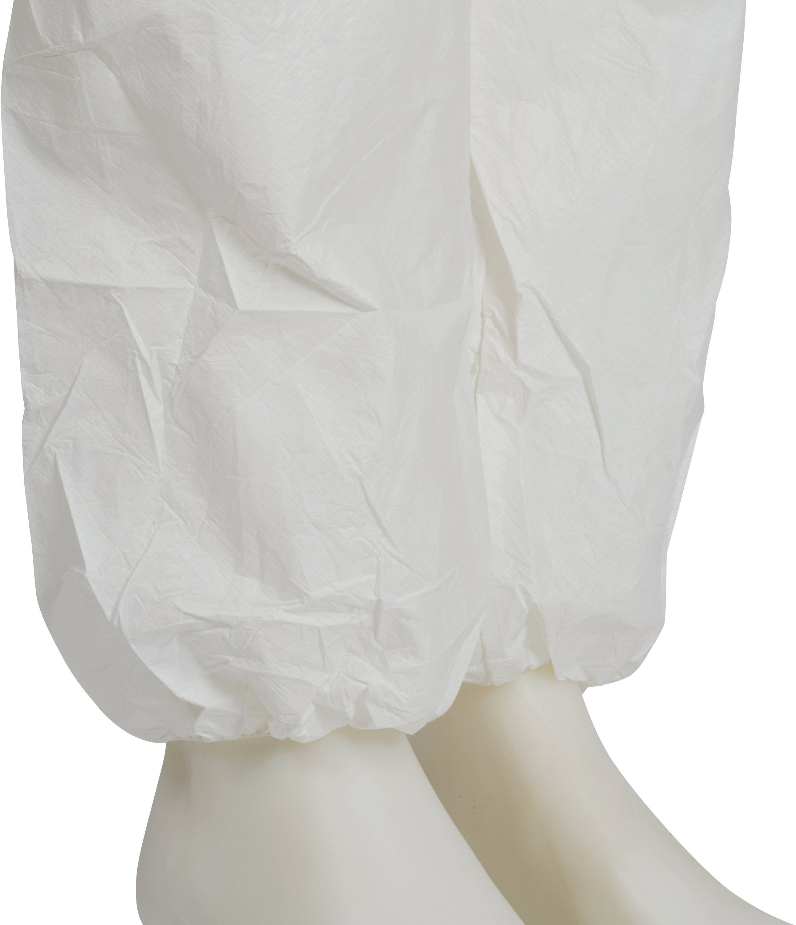 A person is wearing protective clothing with white overshoes, suitable for laboratory or clean room environments.