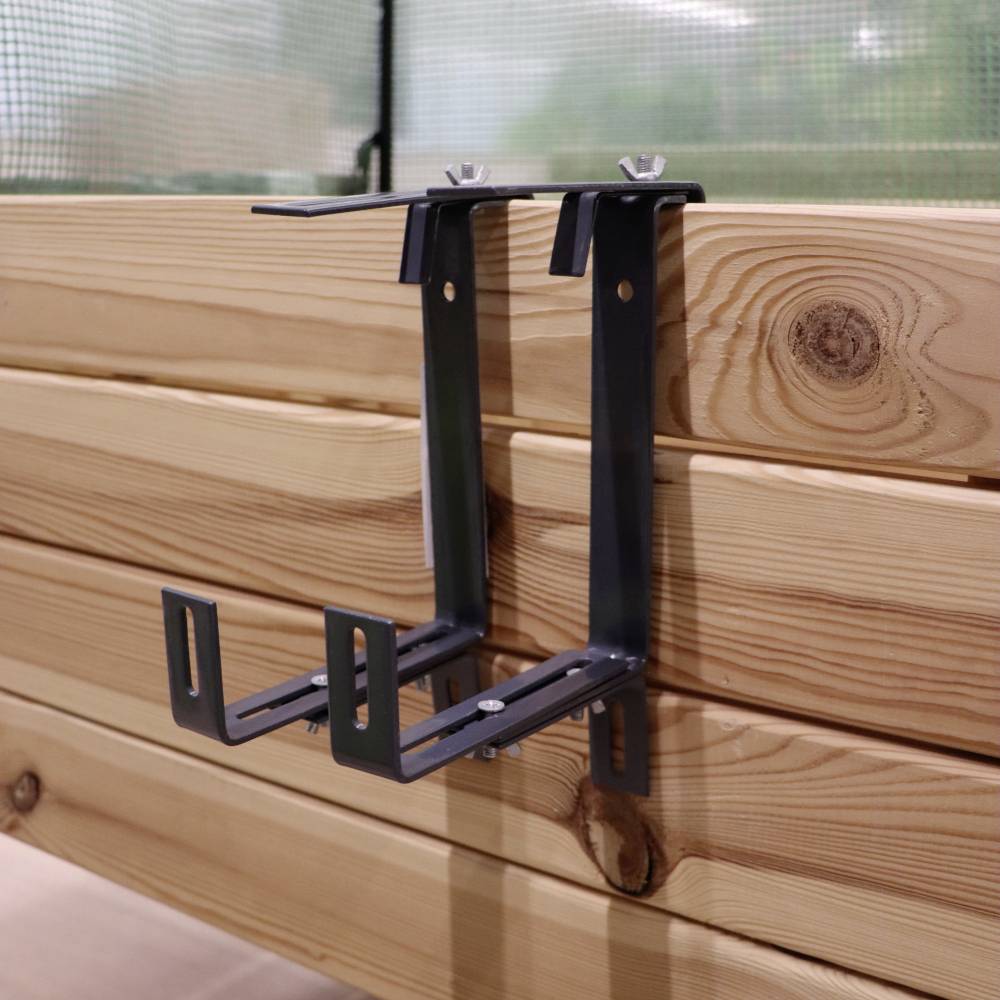 Metal brackets mounted on a wooden structure, ready for assembly or attachment; focus on stability and material quality.