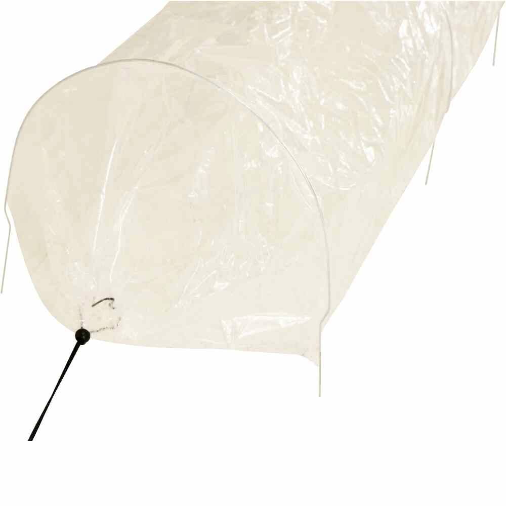 A transparent plastic plant tunnel used for protecting and nurturing plants outdoors.