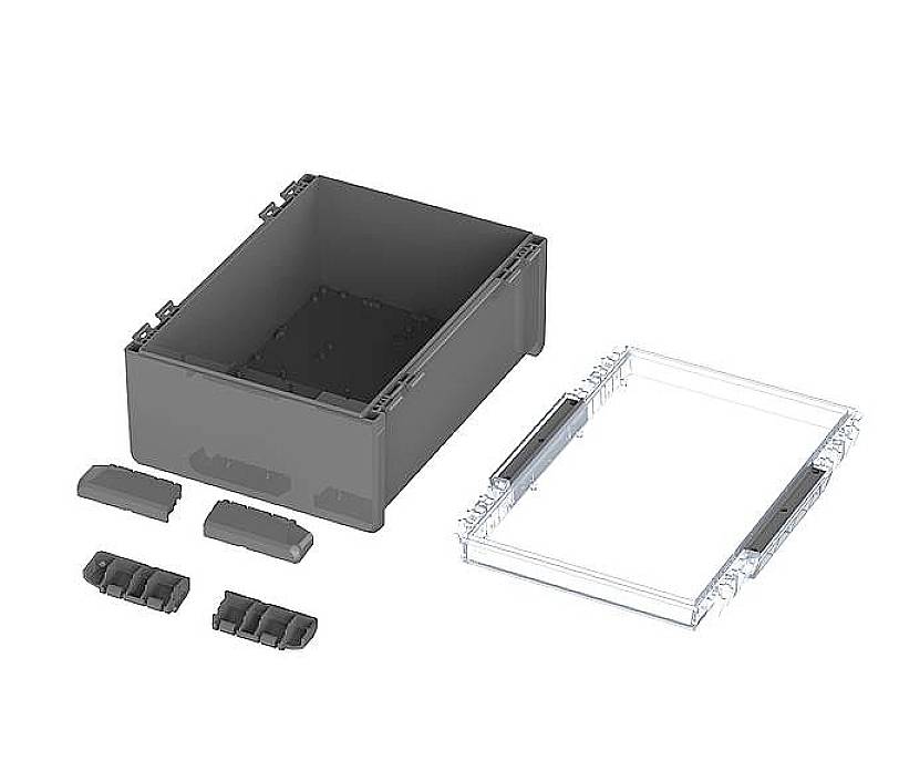 A black container with a transparent lid, accompanied by four small black inserts.