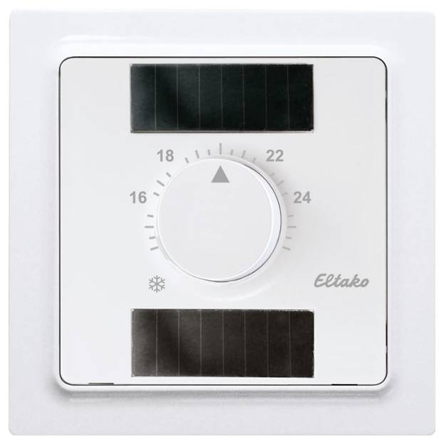 A white Eltako thermostat with a rotary dial, indicating temperatures between 16 and 24 degrees Celsius, surrounded by solar panels.