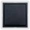 Black square plastic switch on white background.