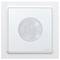 A white motion sensor in a square shape, with a circular sensor field at the front. Wall-mounted, with the manufacturer's logo in the bottom right corner.