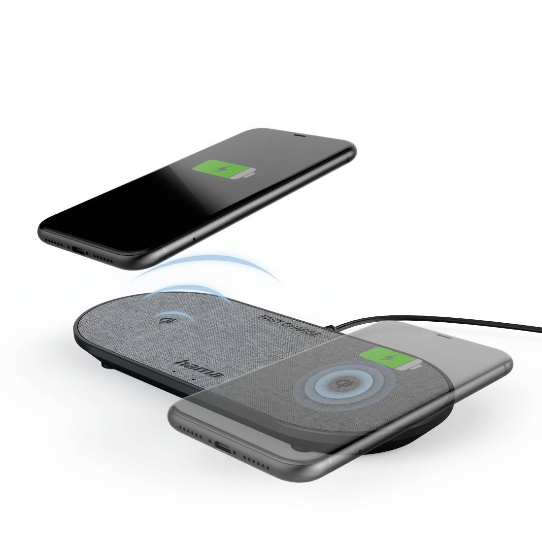 Two smartphones charging wirelessly on a charging pad with a charging indicator. One mobile phone hovers above, displaying a fully charged battery indicator.