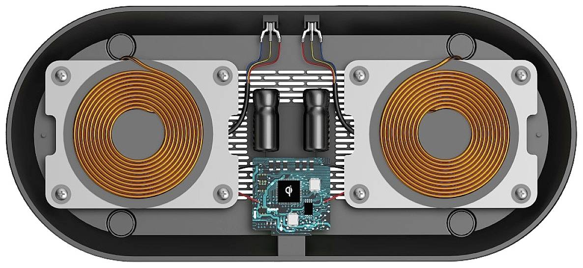 'Top-down view of a wireless charger with two copper coils and a central control unit. Main components are visible.'