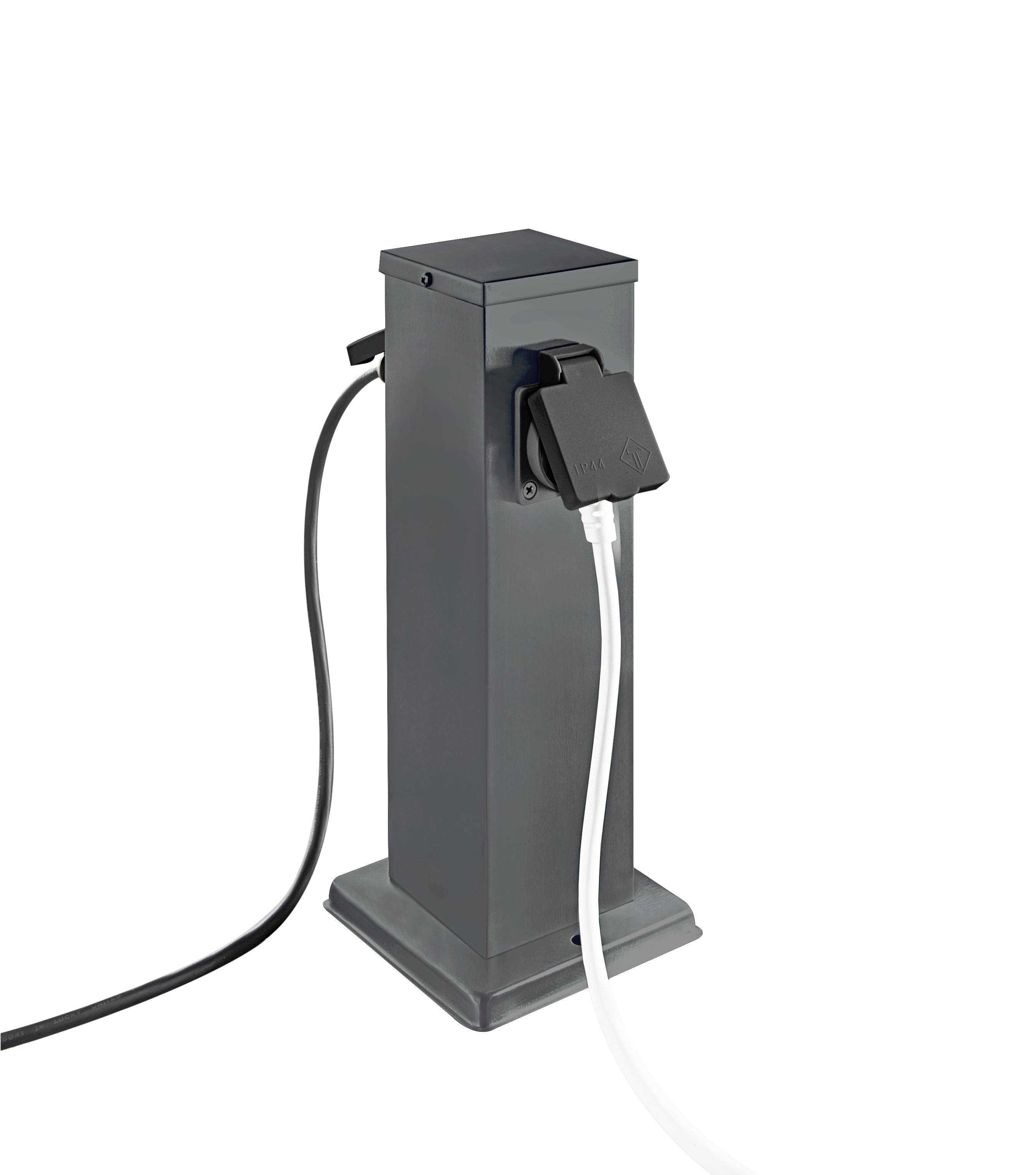Grey electrical socket column with two plugged-in cables, one black and one white; used for charging or power supply.