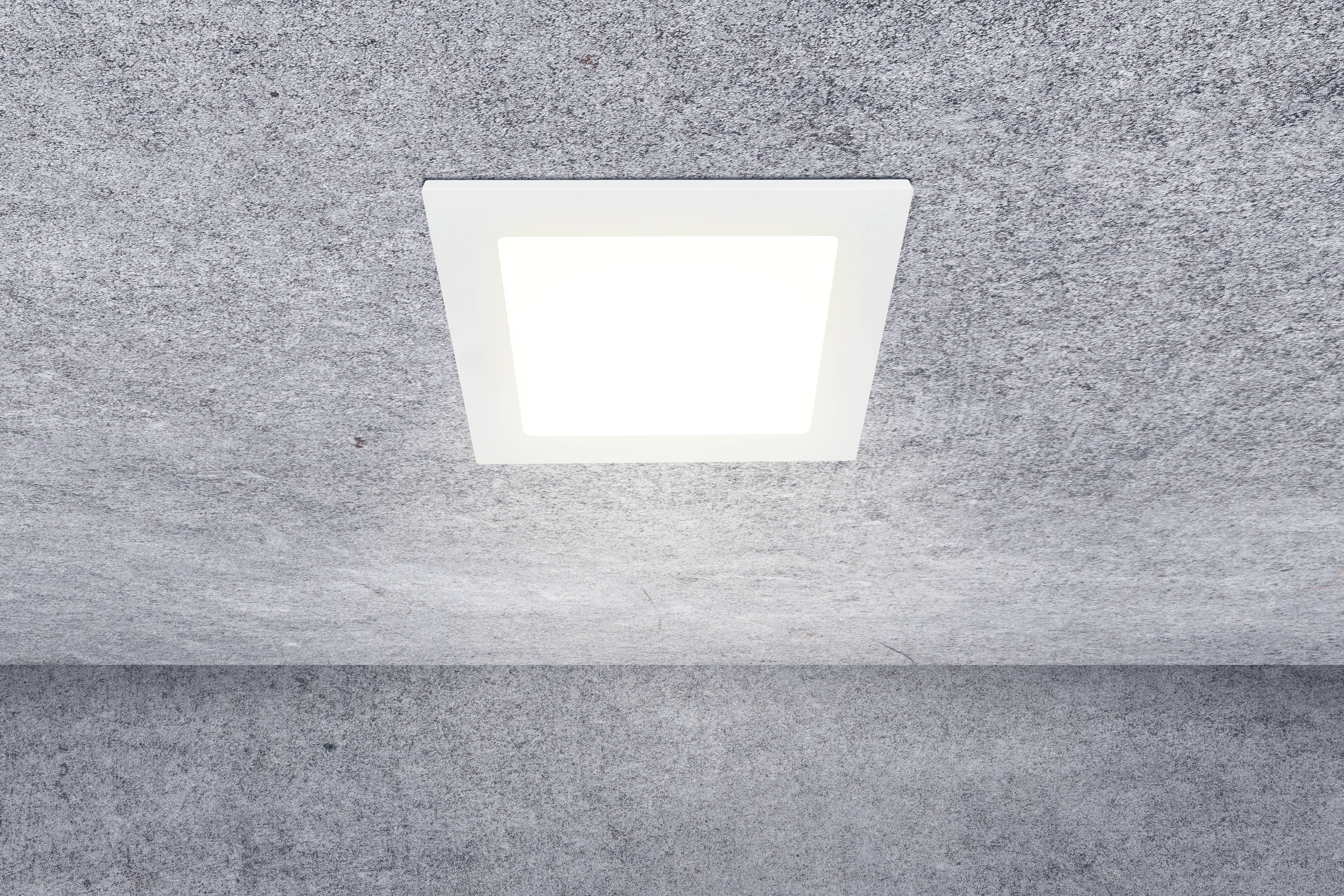 A square ceiling light shines brightly in a room with a grey, textured ceiling.