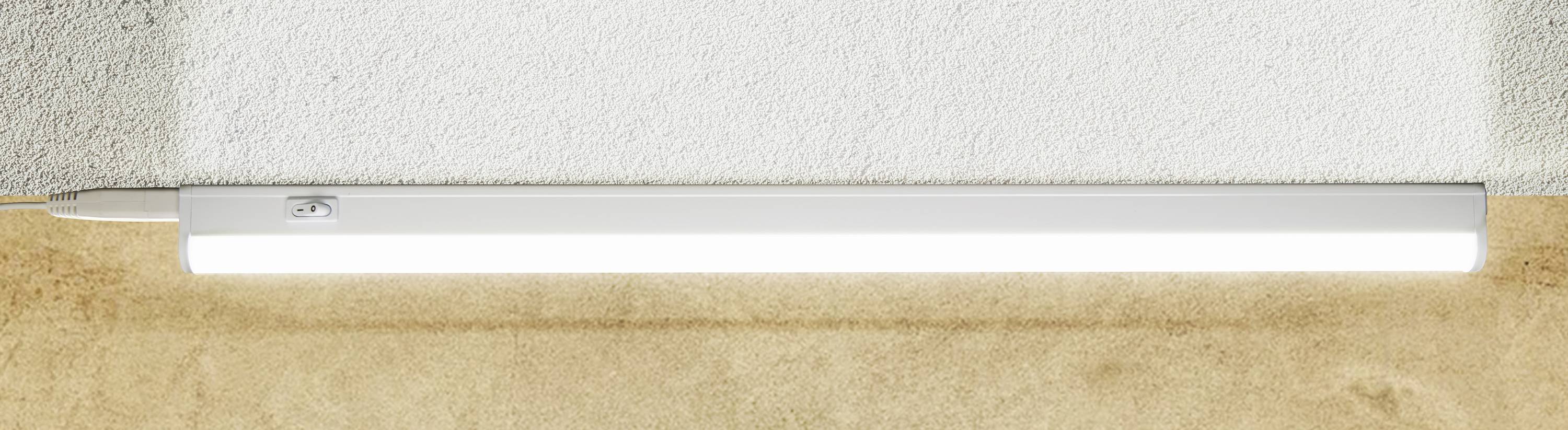 LED light mounted on a wall, emitting white light.