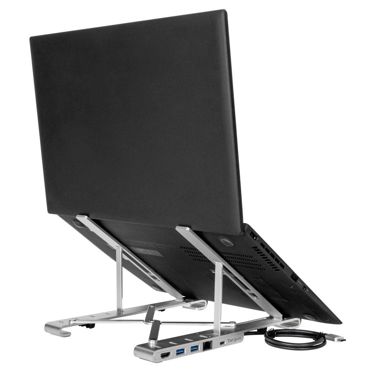 Portable laptop stand in aluminium-effect finish shows a laptop in an upright position; multiple USB ports and cables visible.
