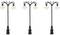Three identical, decorative street lamps with black, metallic design and round light bulbs are arranged side by side.