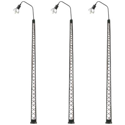 Three identical, tall street lamps with black, lattice-like frames and curved lamp arms are arranged side by side.