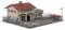 Small model of a workshop with two garages, a fence and a sign reading 'Scrap Metal Collection'.