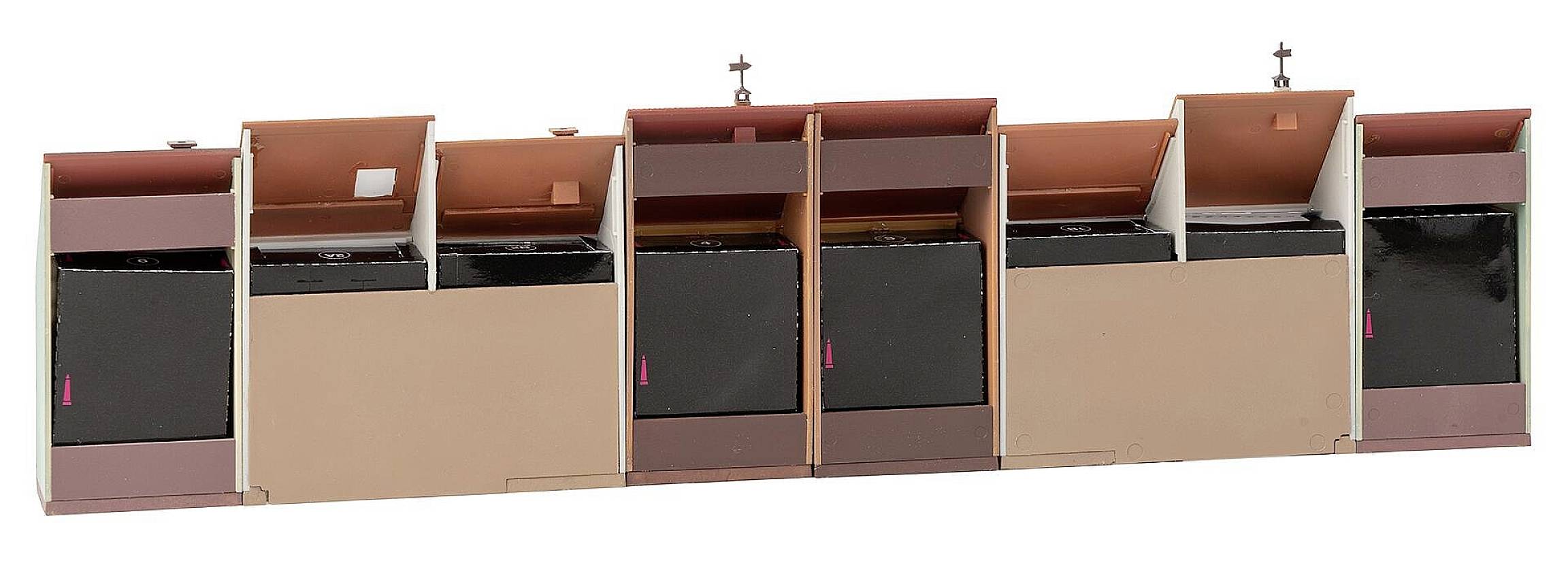 Several open postboxes in a row, different colours, with flaps open upwards.