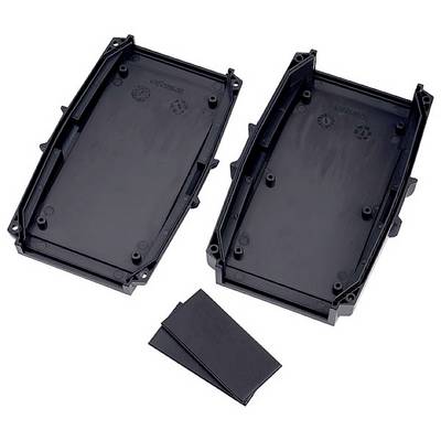 Two black plastic housing parts are lying side by side. Two small rectangular objects are located next to them on the right.