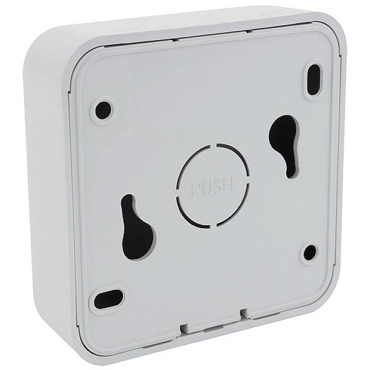 A square, white housing with a rounded dome in the centre; inscription 'PUSH'. Suitable for wall mounting.