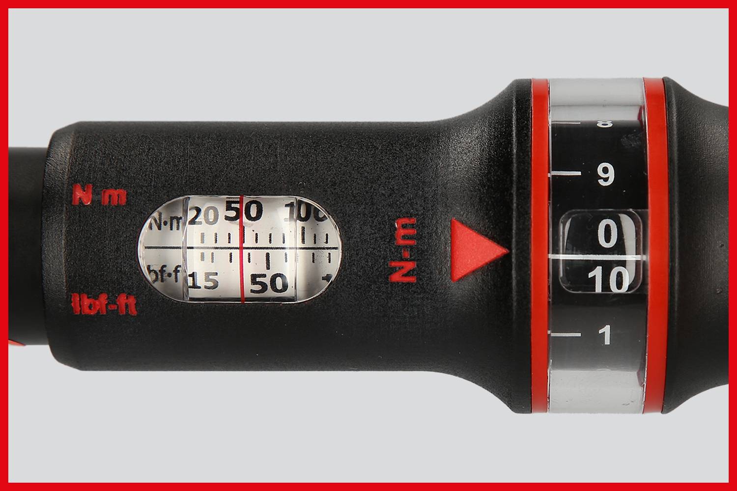 Close-up of a torque wrench with a scale for newton-metres (Nm) and foot-pounds (lb·ft), showing a range from 0 to 50 Nm.