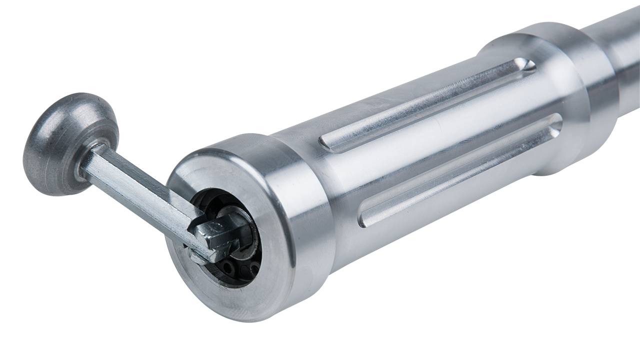 Silver metal hand crank with a cylindrical grip and extended lever, showing a precise piece of engineering equipment.