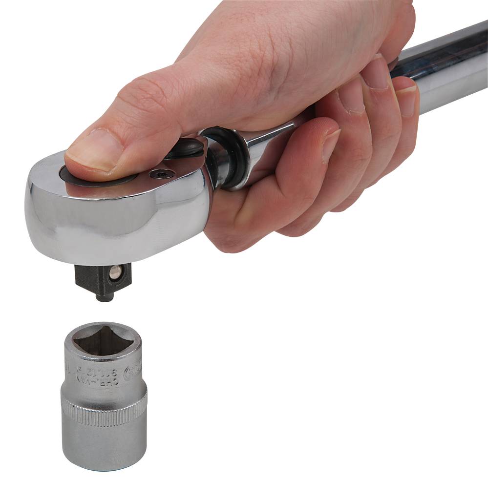 A hand is holding a torque wrench over a socket, ready to place it on.