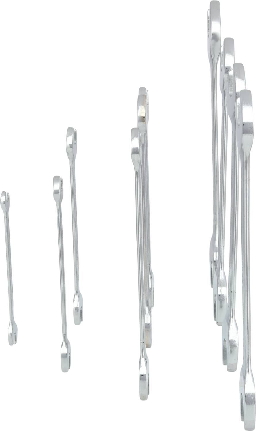 Several silver ring spanners of different sizes, standing side by side on a white background.