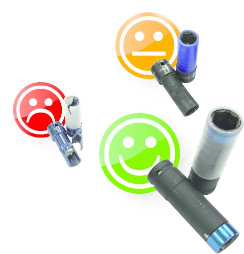 Three spanners with colourful smiley faces in the background: a red sad face, an orange neutral face, and a green happy face.