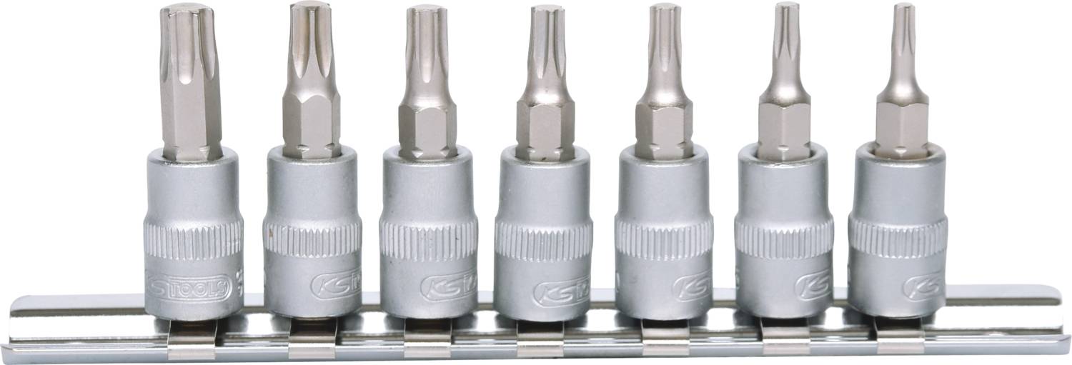 A set of seven silver screwdriver bits of different shapes and sizes, neatly arranged on a metal holder.