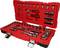 Red tool case with open compartments, containing various socket wrenches, ratchets, and bits in an organised arrangement.