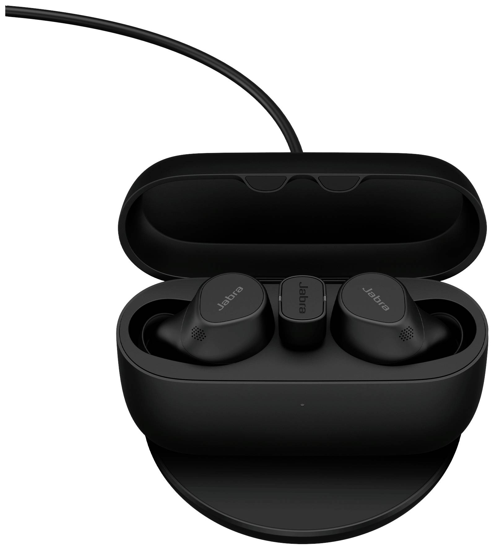 Black wireless earbuds in an open charging case, resting on a wireless charging pad.