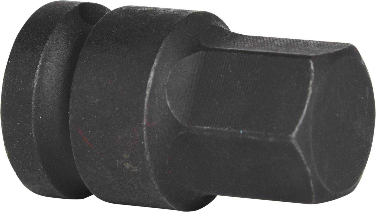 A black, hexagonal metal tool attachment, possibly an adapter or attachment for screw-related work.