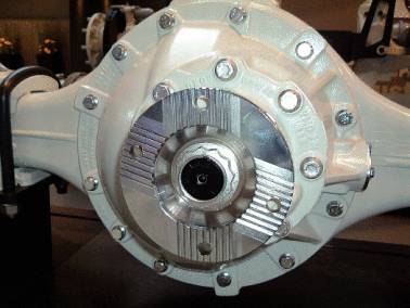 Close-up of a vehicle differential with visible screws and a metal casing protecting the mechanical components.