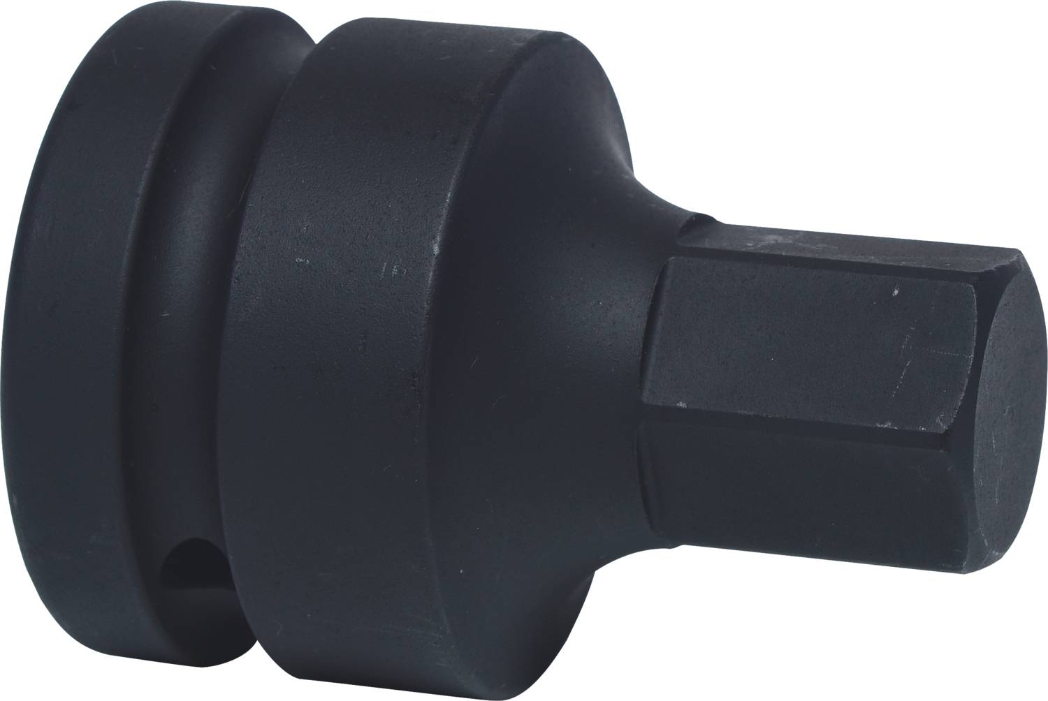 A black, cylindrical metal adapter with a square and a hexagonal opening, used for tools.