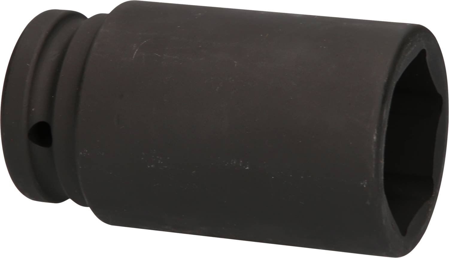 A black metal socket wrench, cylindrically shaped, suitable for use in heavy machinery or vehicles.